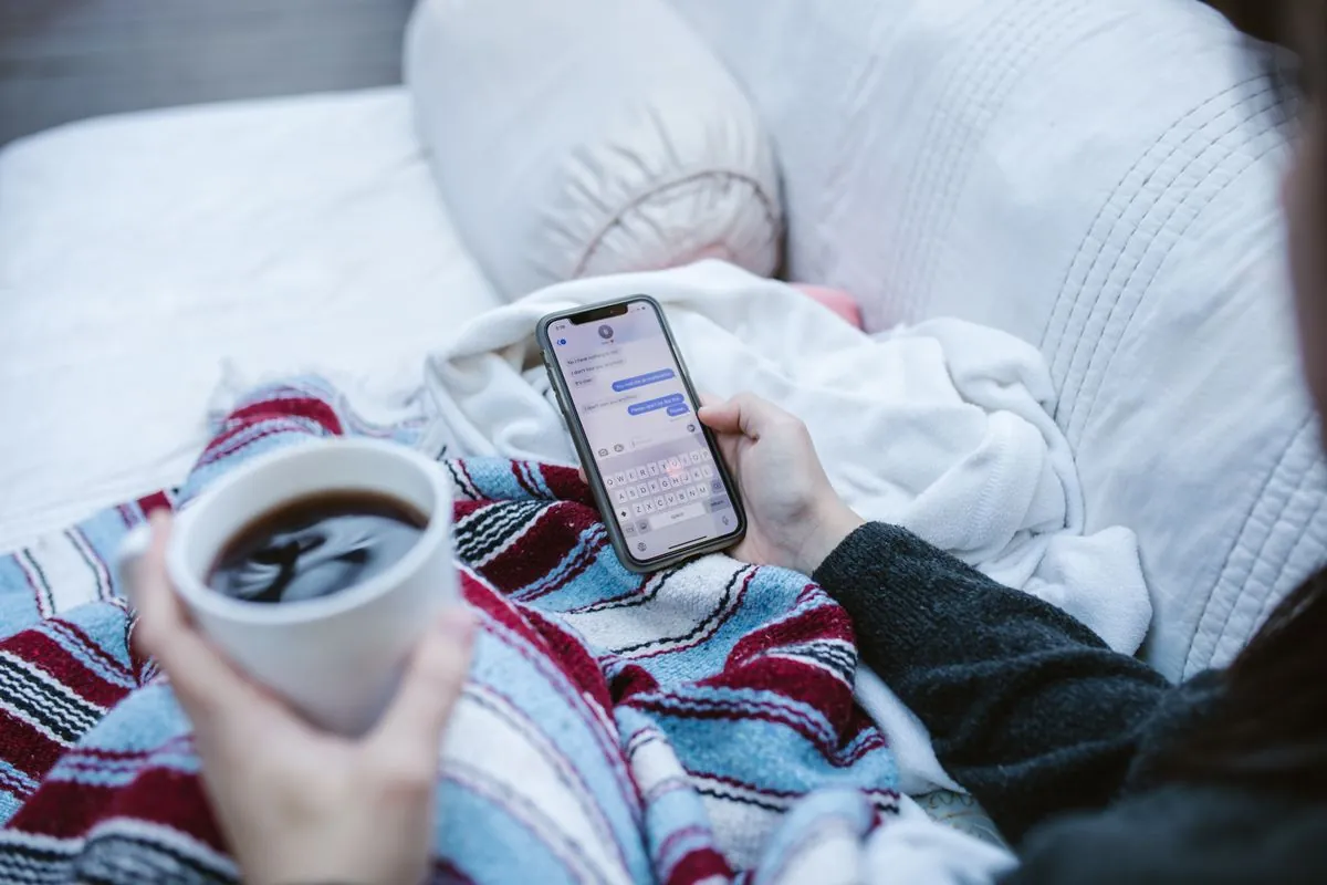 A student messaging safely on a dating app at home.