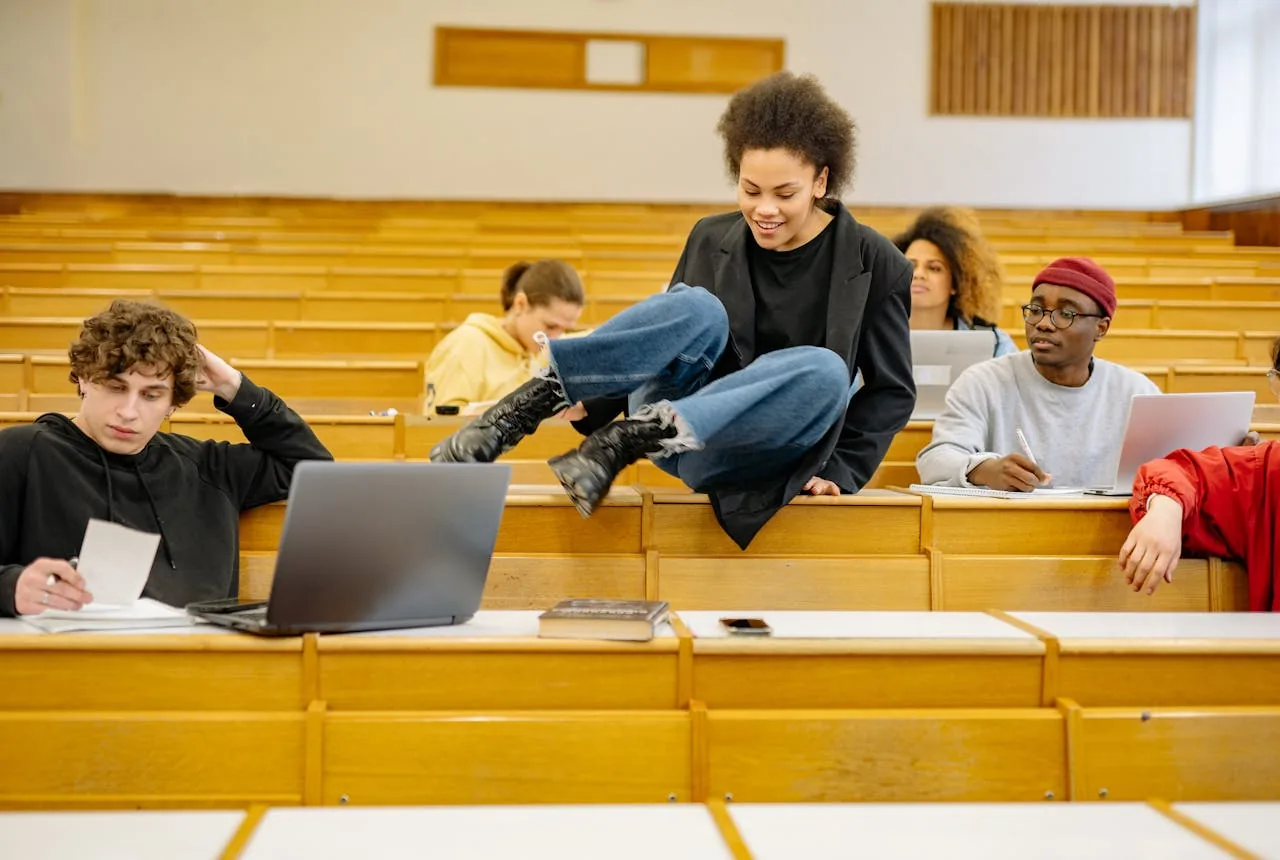 University students studying and collaborating together in a lecture hall.
